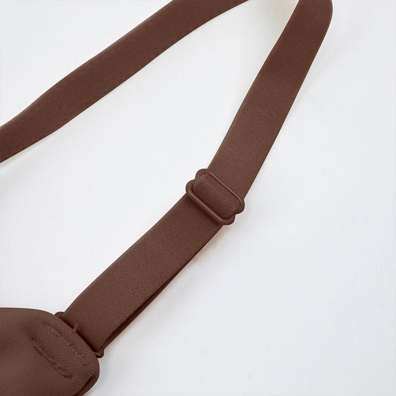 removable straps of strapless shapewear lays flat on white background