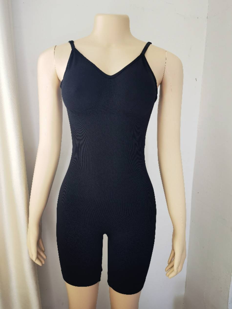 seamless mid thigh backless tummy control shapewear by a model
