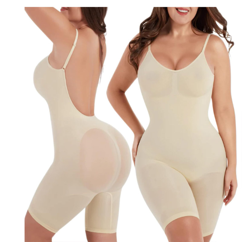 white seamless mid thigh backless tummy control shapewear by a model
