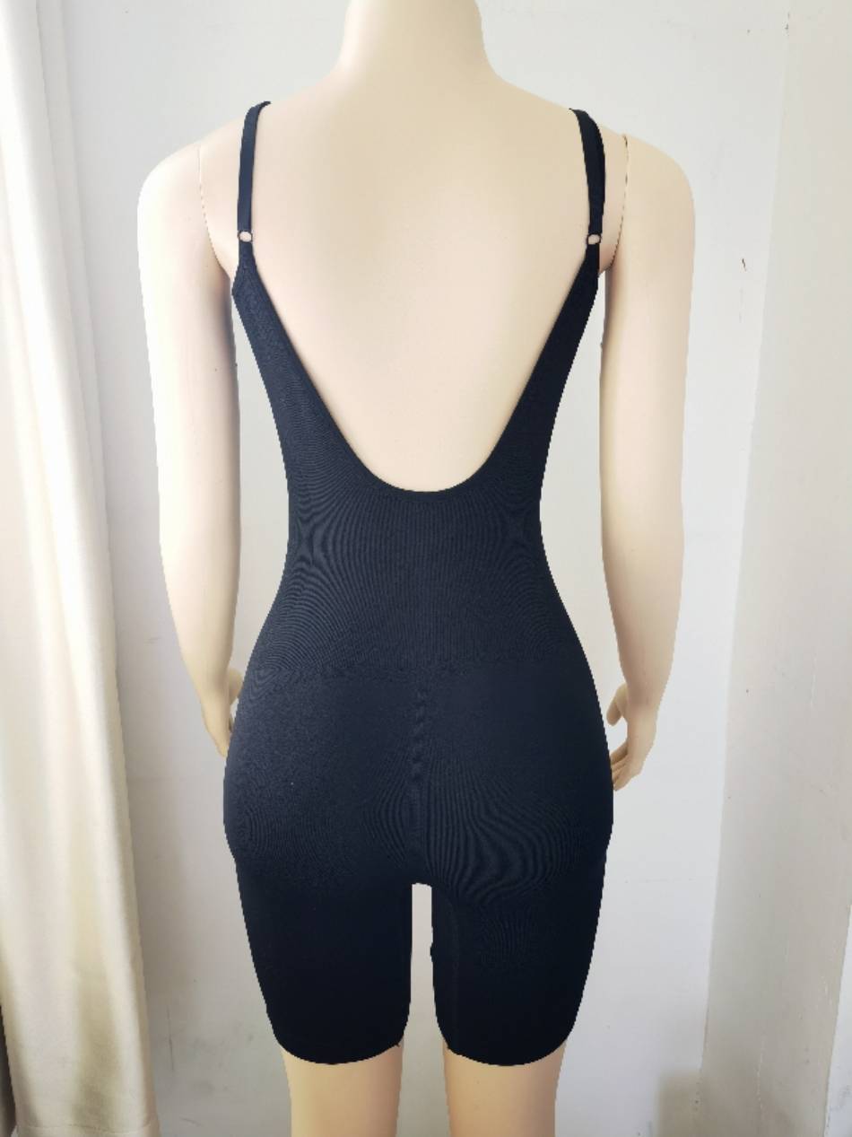 seamless mid thigh backless tummy control shapewear by a model back view