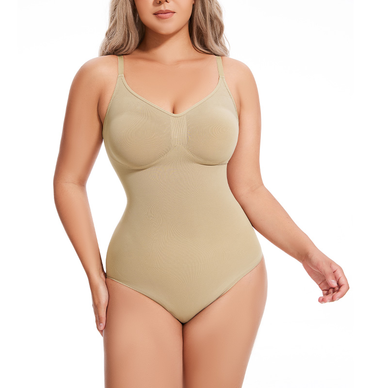 a model poses wearing the begie seamless brief bodysuit 