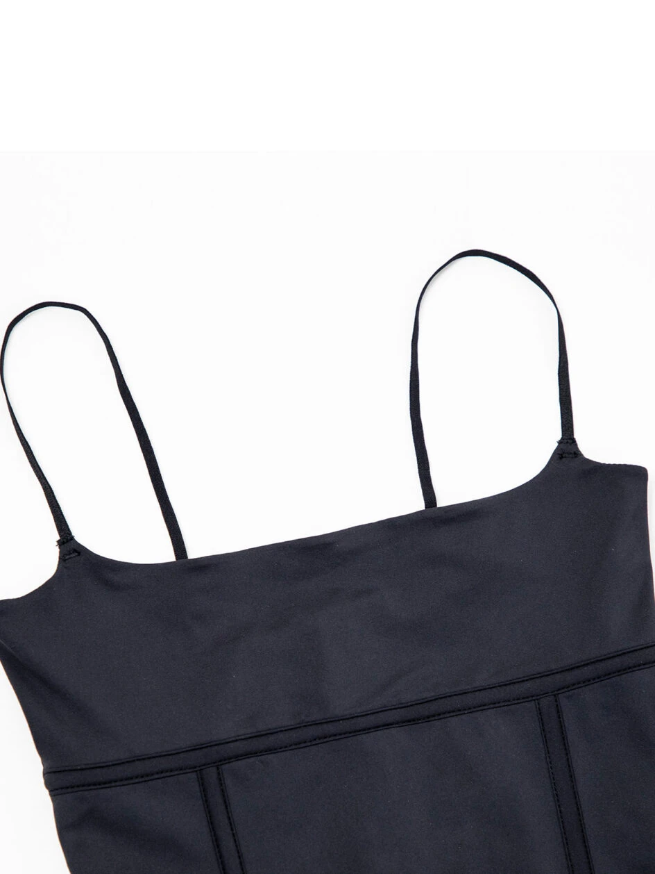 Flat-lay-detail-showing-the-square-neckline-and-thin-spaghetti-straps-of-the-black-Corset-Cami-Thong-Bodysuit.