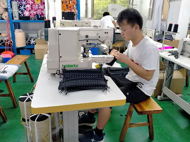 Worker Producing Shapewear with Santoni Machine