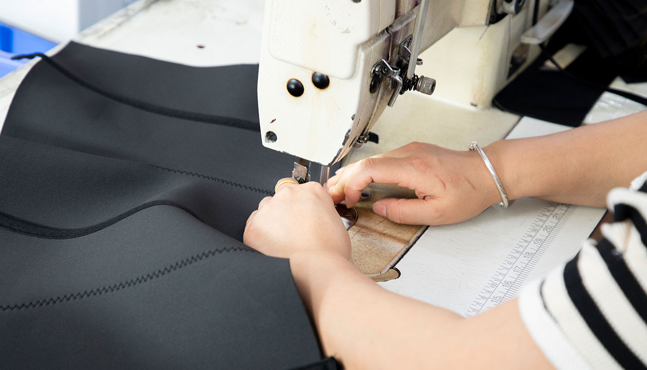 Waist trainers being sewn on our production line in Shenzhen